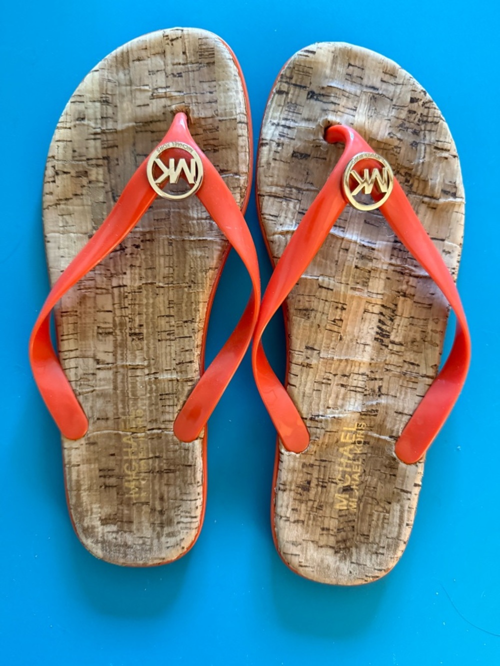 Michael Kors Orange Jelly Cork-Effect Flip Flops with Gold MK Medallion